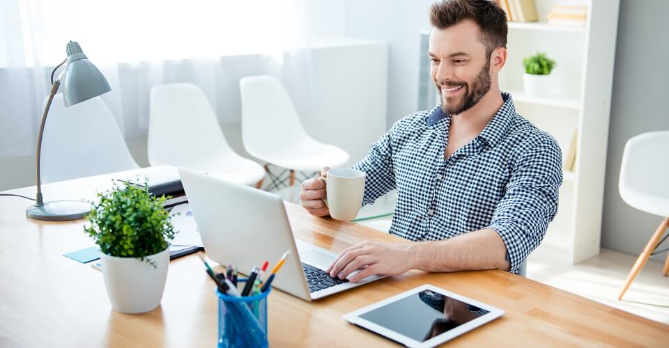 A man is looking at a computer